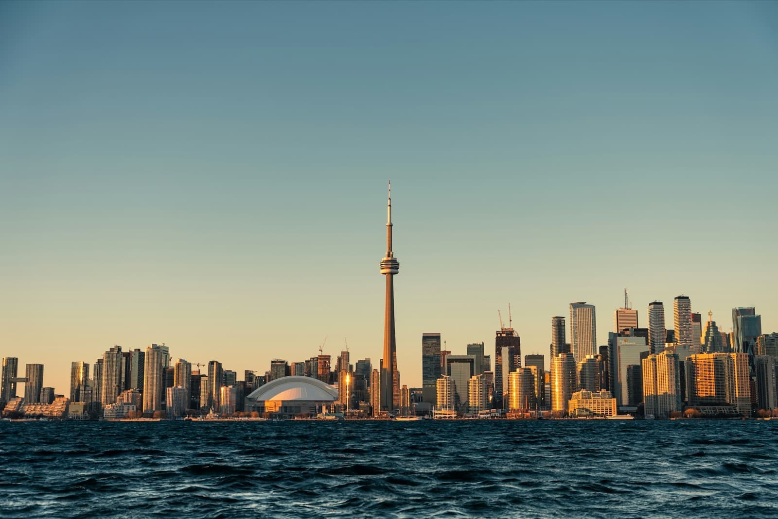 The Toronto skyline at sunset, seen across the lake from the Islands